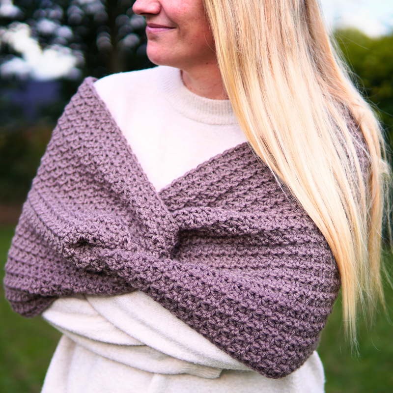 A crocheted wrap with a twist