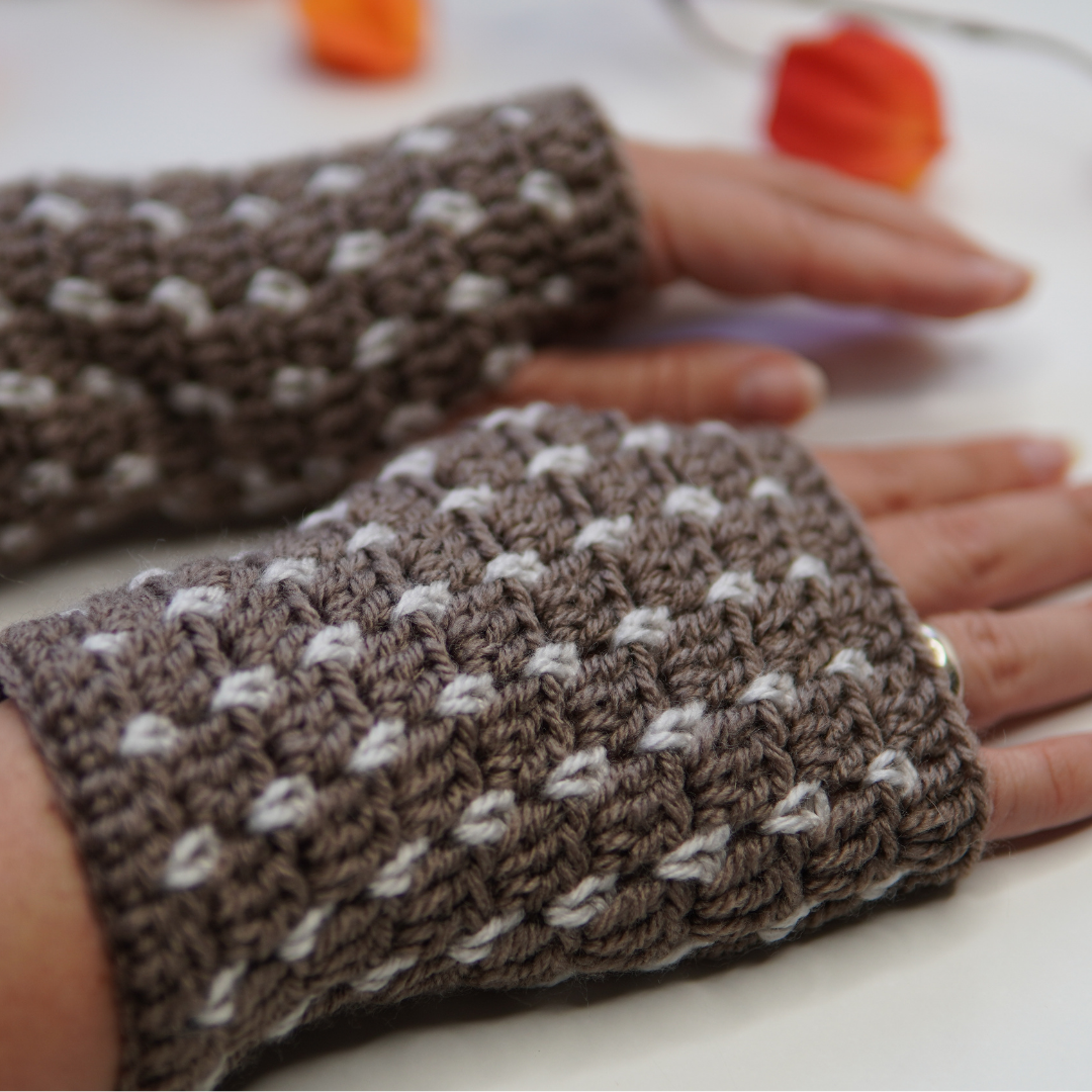 Crocheted fingerless gloves in the blocks stitch pattern and brown yarn from hobbii