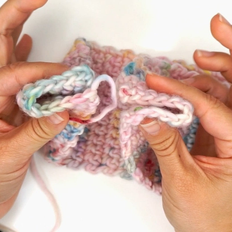 The sewing of the headband in x-twist