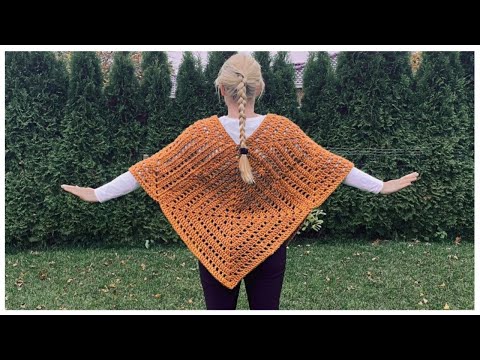 youtube thumbnail, woman, outside, crocheted poncho, made of granny squares, green grass, green hedge