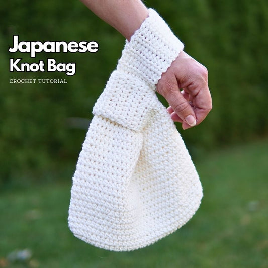 A crocheted Japanese Knot bag made in white cotton yarn