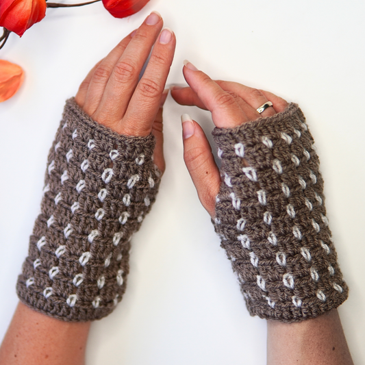 Crocheted fingerless gloves in block stitch pattern