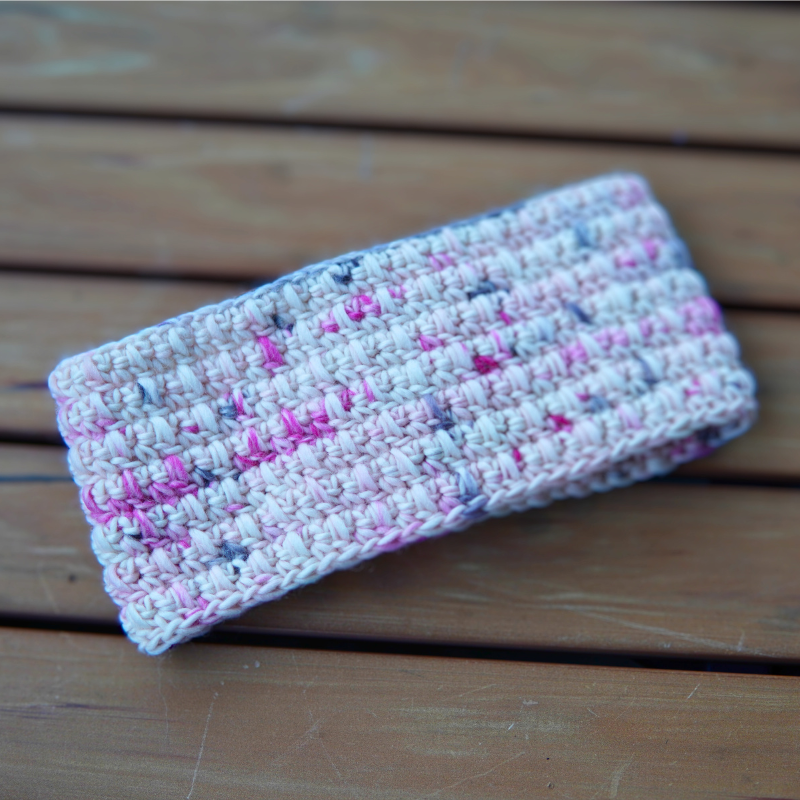 Crocheted headband in flamingo yarn from We are Knitters