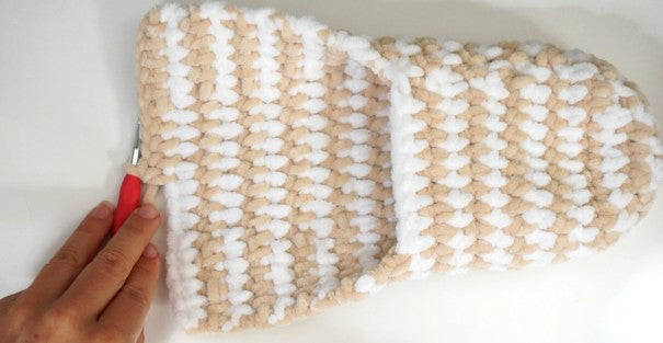 Close-up of chunky crochet slipper base in beige and white super bulky yarn