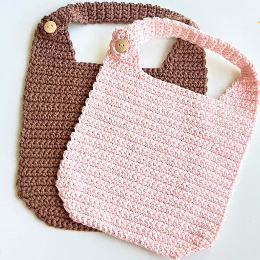 Crochet an adorable baby bib with this beginner-friendly PDF pattern. Uses simple single crochet, a 4 mm hook and includes video tutorial support.