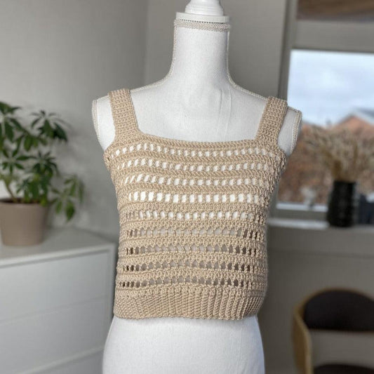 A crocheted top in a mesh pattern
